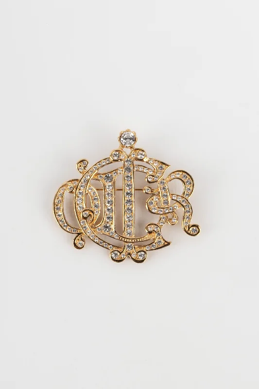 Broche dorée Dior